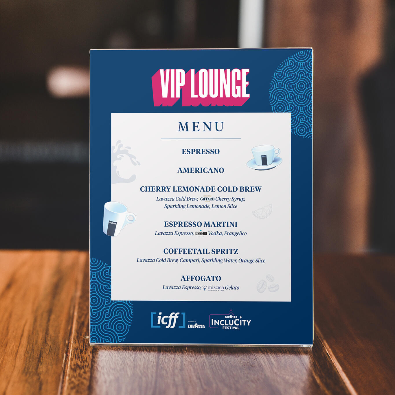 Drink menu design for Lavazza mocked up in an acrylic stand on a wooden table.
